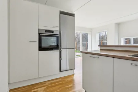 Hyggelig 3-plans lejlighed med moderne faciliteter og tagterrasse 1