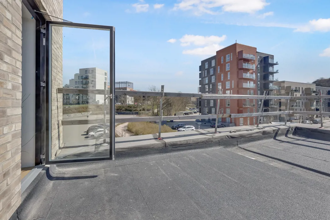 Nyopført 3-værelses lejlighed med tagterrasse på Ankomstpladsen 9
