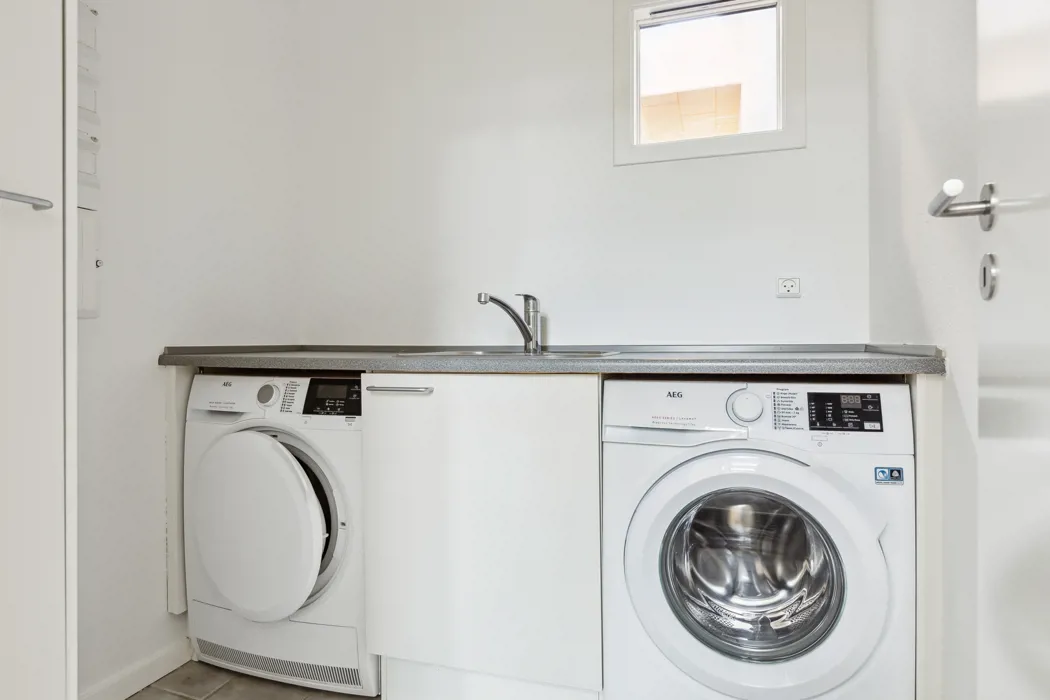 Hyggelig 3-plans lejlighed med moderne faciliteter og tagterrasse 12