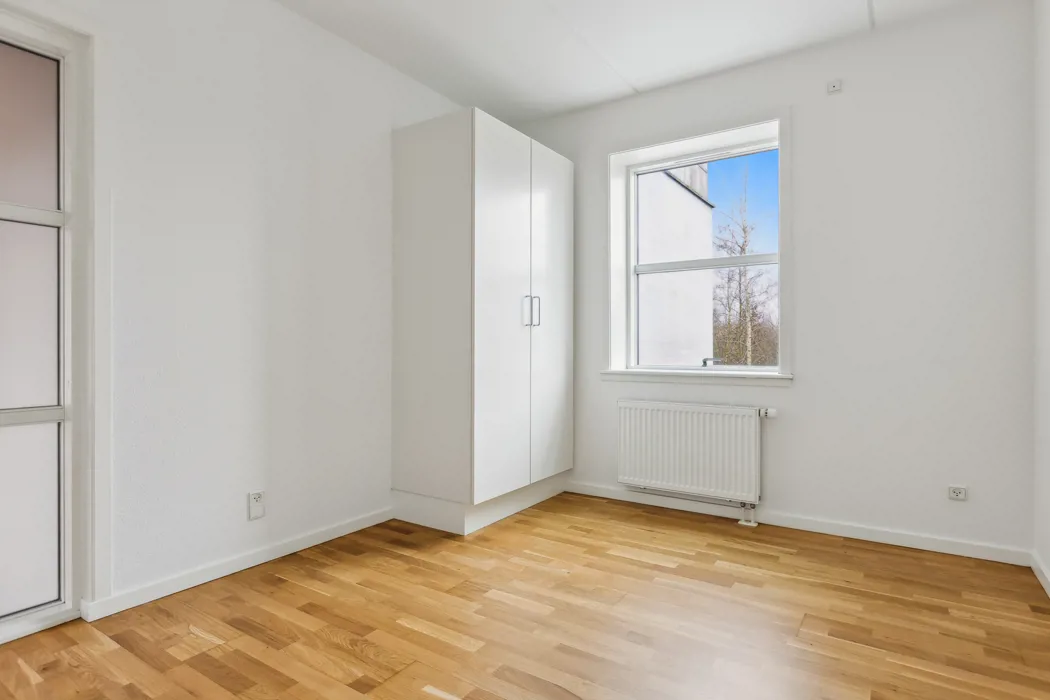 Hyggelig 3-plans lejlighed med moderne faciliteter og tagterrasse 8